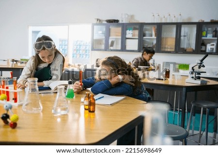 Elementary students studying in laboratory