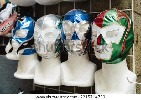 Mexican wrestling masks on mannequin heads. Traditional sport souvenir from Mexico