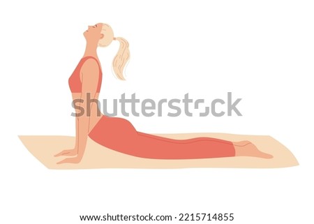 Woman exercises at home, stretches out, curves her back lying on the floor