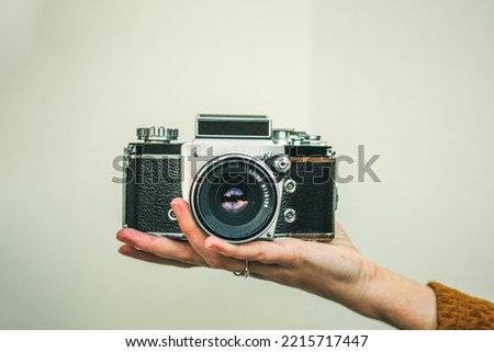 vintage analog camera in female hand