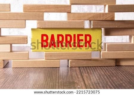 Barrier. Wooden letters on the office desk, informative and communication background