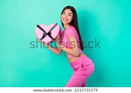 Photo of young charming lovely woman receive 14 february present from boyfriend isolated on turquoise color background