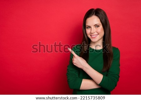 Photo of charming woman hairdo hand direct empty space product sale offer wear stylish green garment isolated on shine red color background