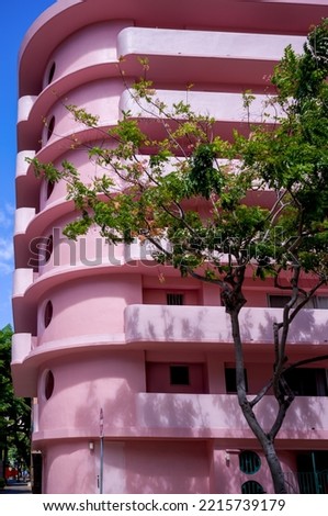 Round Pink Building Corner with Art Deco Architecture.