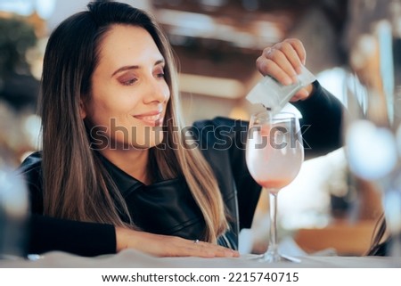 
Happy Woman Dissolving Collagen Powder in a Glass of Water. Lady preparing herself a healthy supplement with anti-aging benefits
