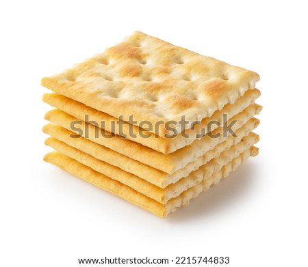 Crackers placed on top of each other on a white background. Royalty-Free Stock Photo #2215744833