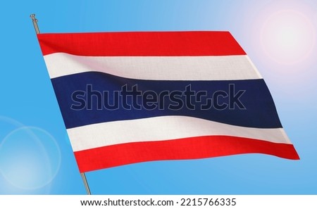 Waving national flag of Thailand on blue sky