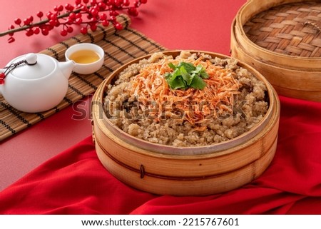 Close up of delicious Chinese glutinous sticky oil rice cake named migao for lunar new year's dishes with sakura shrimp. Royalty-Free Stock Photo #2215767601