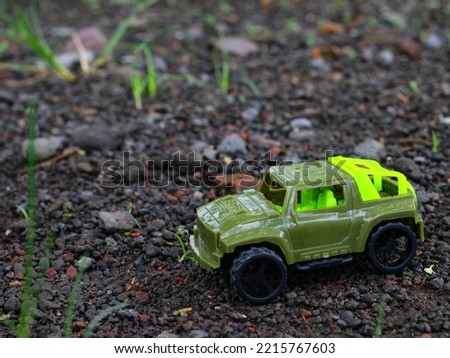 Plastic green Car Sport Version. Children's favorite toys. Royalty-Free Stock Photo #2215767603