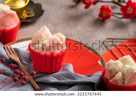 Cute tasty fresh traditional Chinese steamed sponge cake - Fa Gao, for lunar new year festival celebration food in pink and white color. Royalty-Free Stock Photo #2215767645