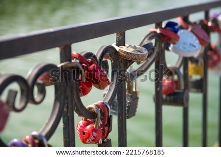 Locks on the fence. wedding signs with the names of the newlyweds