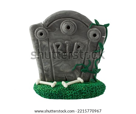 Carved stone tombstone made of plasticine. Tombstone for halloween. Plasticine grave isolated on transparent background
