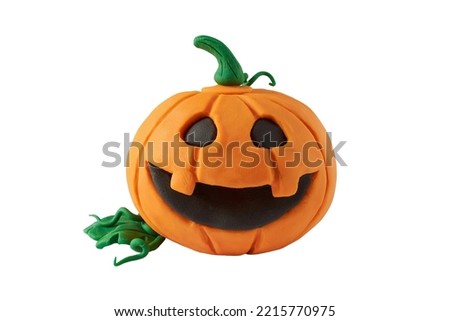 Halloween pumpkin made of plasticine, isolated on transparent background. Orange pumpkin with a happy face. autumn symbol