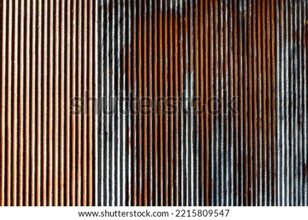 Artistic of old and rusty zinc sheet wall. Vintage style metal sheet roof texture. Pattern of old metal sheet. Rusting metal or siding. Corrosion of galvanized. Background and texture in retro concept Royalty-Free Stock Photo #2215809547