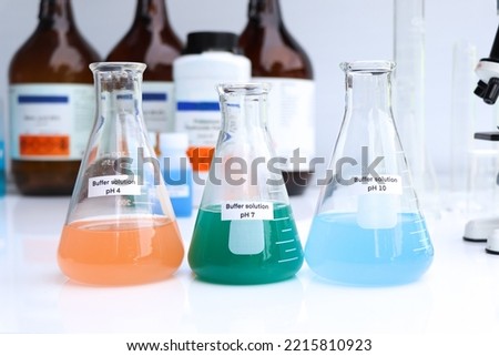 Buffer solution in glass, chemical in the laboratory and industry, Chemicals used in the analysis Royalty-Free Stock Photo #2215810923