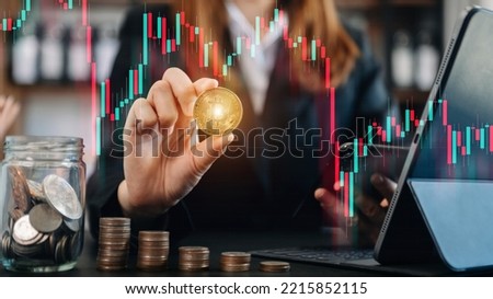 Business and Finance, Savings, Investing with Digital Assets, Future finance, blockchain. Business man holding golden Cryptocurrency hologram, bitcoinon financial growth chart.
