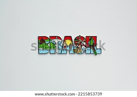 Colourful PVC souvenir fridge magnet of Brazil isolated on white background. Travel memory concept. Gift typical product for tourists from foreign trip. Home decoration. Top view, flat lay, close up
