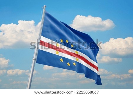 Cape Verde flag and blue sky with clouds.