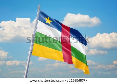 Central African Republic flag and blue sky with clouds.
