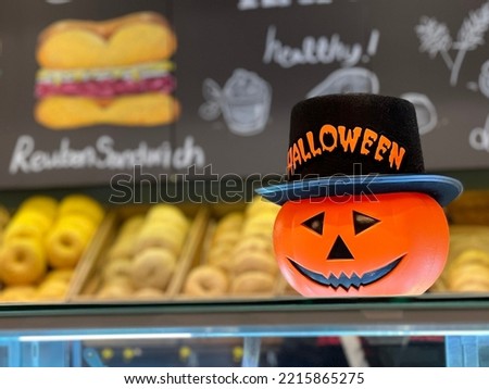 Halloween Pumpkin Smile Autumn Trick or Treat Event Inside Out of focus Decor Seasonal Party Festival Yellow Orange Red Black Bagel Cafe 