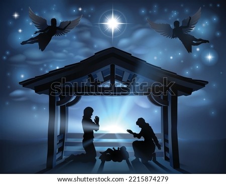 Traditional Christian Christmas Nativity Scene of baby Jesus in the manger with Mary and Joseph in silhouette.  The star of Bethlehem is over head with angels.