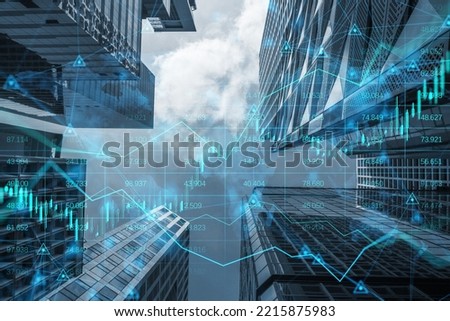 Real estate investing concept with digital financial chart diagram, candlestick and graphs on modern skyscrapers background perspective view, double exposure
