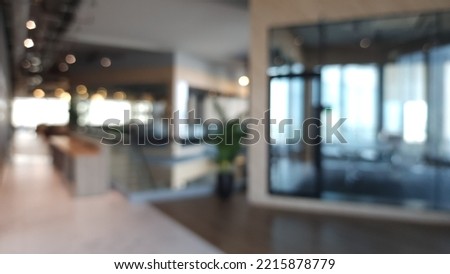 Blur focus of Fashion and modern office interiors. Front view of a loft open space office interior. Blur background. Royalty-Free Stock Photo #2215878779
