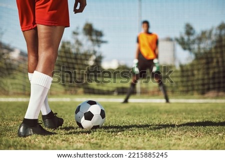 Sports, soccer field and legs of athlete with goalkeeper ready for penalty kick, game or competition for fitness health. Football player, ball or man prepare for outdoor workout, training or exercise Royalty-Free Stock Photo #2215885245