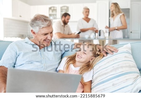 Laptop, child and grandfather with comic video on the Internet and the living room sofa of their house. Girl with smile for subscription service on tech with funny movies and an elderly man