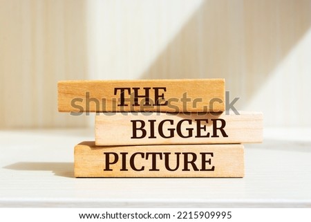 Wooden blocks with words 'THE BIGGER PICTURE'.