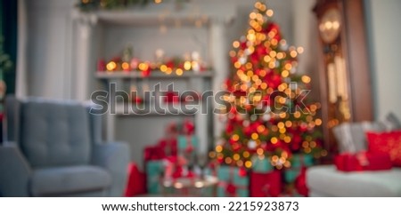 Closeup blur Christmas banner interior bokeh light background for your photo montage or product display. Copy space for placing items.