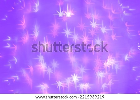 Bokeh as lights white pink stars on lavender color background, happy winter holiday wallpaper with bright blurred pattern. Happy Christmas or New Year abstract magic light aesthetic photo, neon colors