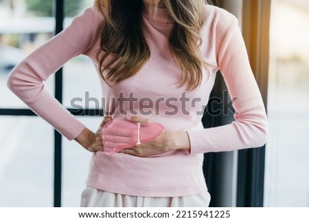 woman hands touching on liver pain organ, asian female with hepatitis vaccination, liver cancer treatment. Healthy feminine concept. Royalty-Free Stock Photo #2215941225