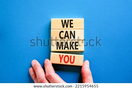 Support and we can make you symbol. Concept words We can make you on wooden blocks. Beautiful blue table blue background. Businessman hand. Business psychological we can make you concept. Copy space