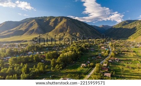 Beautiful car road to the mountains among the trees.Photos of the Republic of Gorny Altai in the summer, "red Mountain" place, aerial photography, Russia