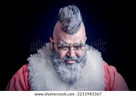 Severe dangerous Santa Claus with mohawk. Evil aggressive gray-haired old man Santa in a bad mood. New Year and Christmas in the company of an unusual bad Santa.