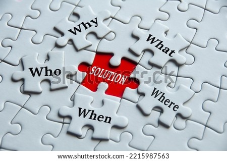 Text on jigsaw puzzle - Why, what, where, who, when and solution. Fact findings and problem solving concept. Royalty-Free Stock Photo #2215987563
