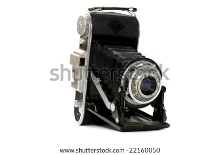 Old folding camera on a white background
