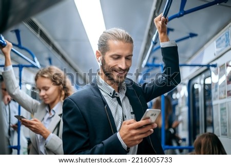 business man traveling to work in the subway. Royalty-Free Stock Photo #2216005733