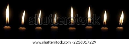 Set The candle flame glows in the dark dark night as a background decoration in religious ceremonies and birthday celebrations. Many people have a happybrightromantic holiday.