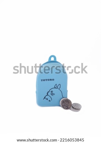 Semarang, Indonesia-October 10, 2022: a small wallet with a picture of Totoro is one of the Japanese anime characters. This wallet is usually used to store coins