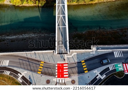 aerial view of bridge with bike path and road signs	