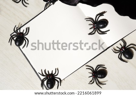 Decorative picture with spiders for Halloween. White background for text for the holiday.