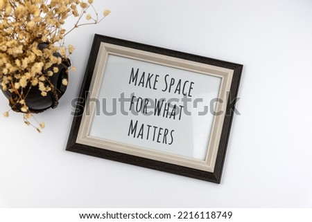 Inspirational quotes text in a frame - Make space for what matters