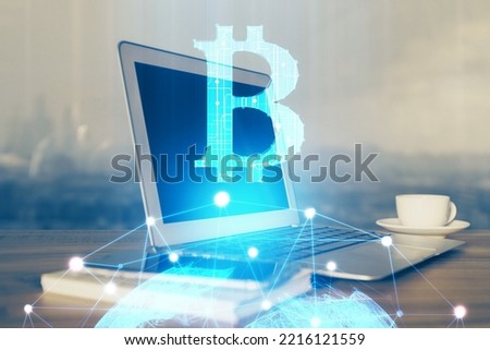 Multi exposure of blockchain theme hologram and table with computer background. Concept of bitcoin crypto currency. Royalty-Free Stock Photo #2216121559