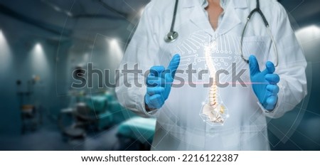 The concept of x-ray examination of the spine and scanning of the patien vertebrae. Royalty-Free Stock Photo #2216122387