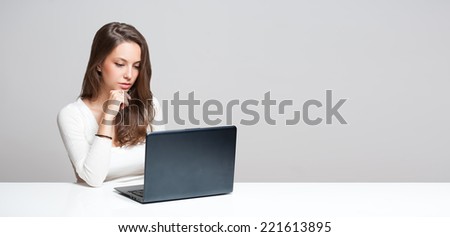 Portrait of a young brunette beauty with her laptop.