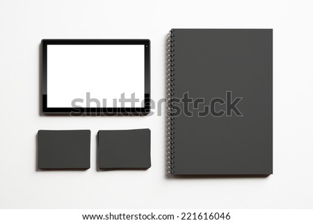 Identity elements and tablet on white background