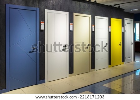 Shop window of doors. A large selection of doors for house. Royalty-Free Stock Photo #2216171203