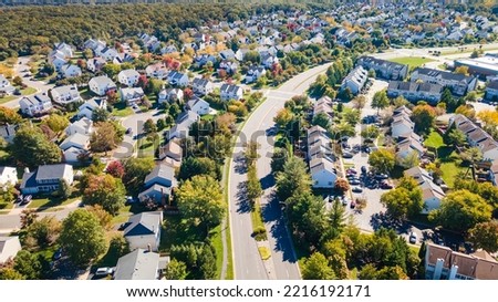 Aerial view of upscale residential area, gated community street real estate with single family homes. Autumn sunny day. Royalty-Free Stock Photo #2216192171